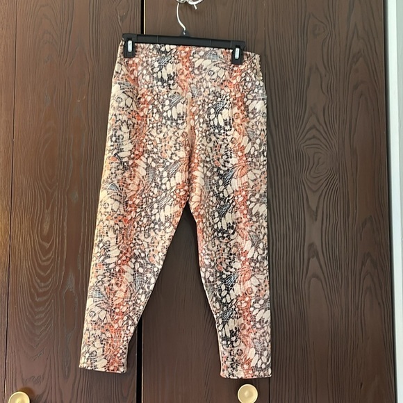 Evolution and Creation orange/cream/black patterned athletic pants. Size Large. - Picture 5 of 6